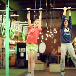 Kids hanging on monkey bars