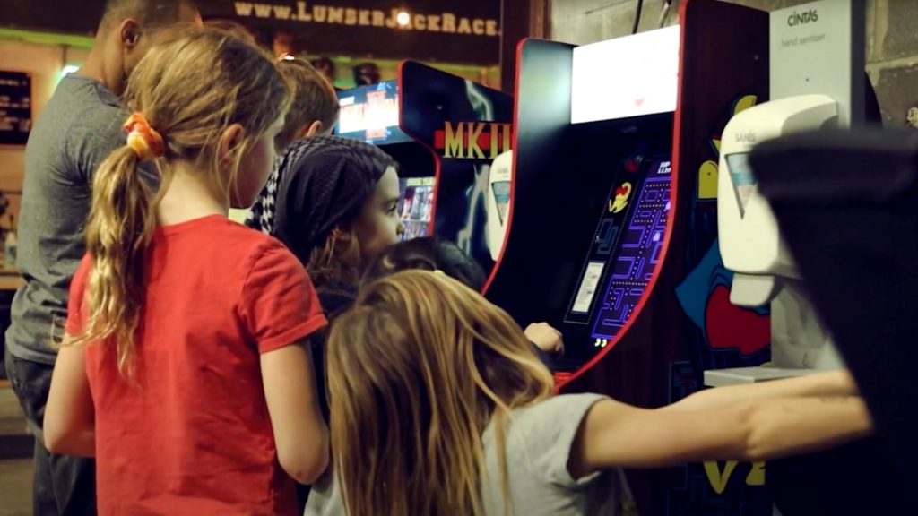 Kids playing retro arcade games at OCR Academy